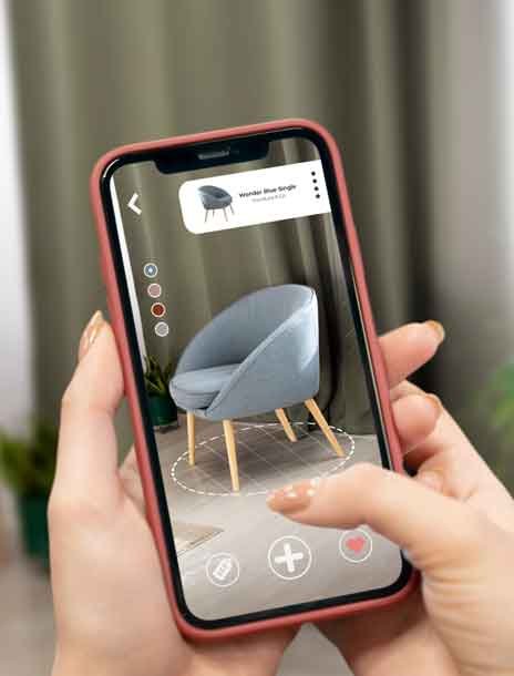 A man watching augmented reality view of a chair